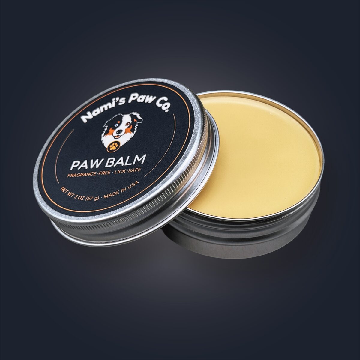 Nami's Paw Balm open tin beside its branded box